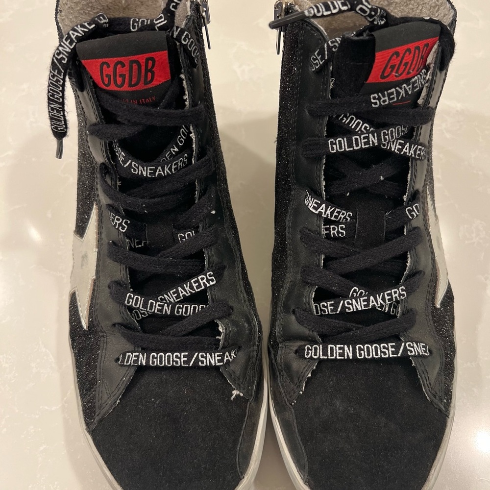 High top Glittery black w/ silver & gold trimming. Perfect condition.